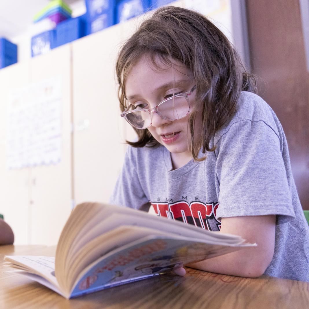  A student reads at their desk